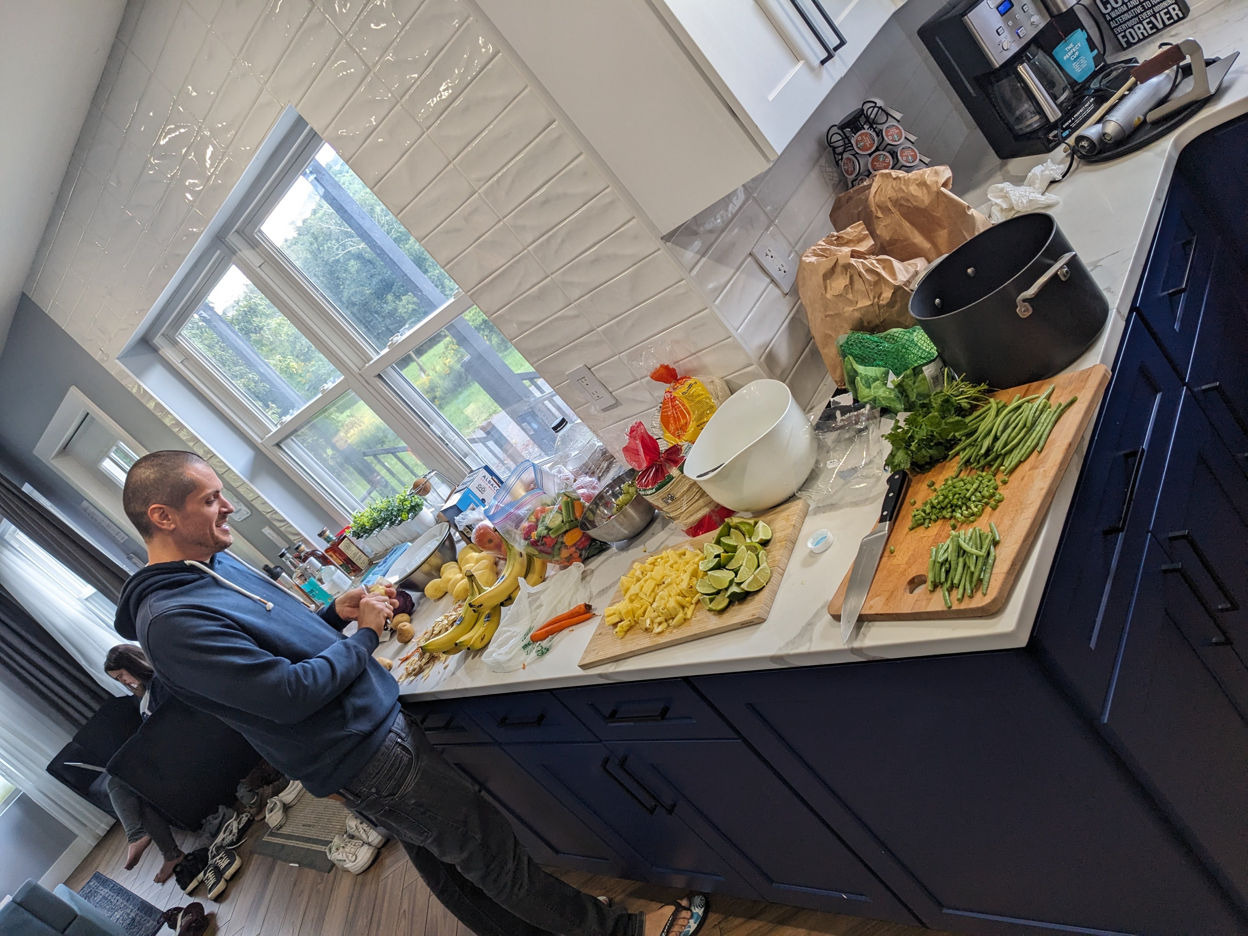 An AuthZedder at a kitchen counter surrounded by chopped vegetables